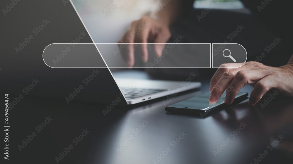 Poster data search technology search engine optimization seo. man hand using mobile phone and laptop comput