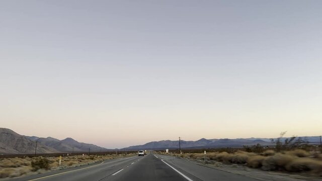 Driving on a  freeway in California desert landscape