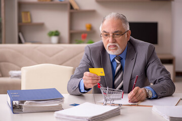 Old male employee in e-commerce concept during pandemic