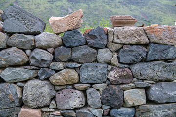 the fortress wall is lined with stones of different textures