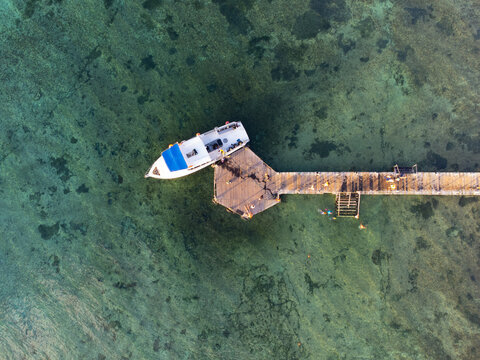 Aerial photo of a boat on the beach of Cozumel in Mexico