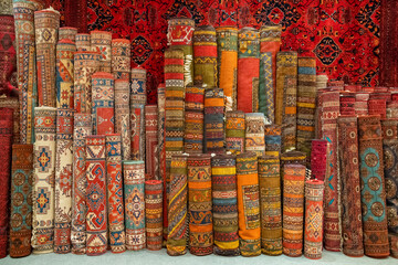 Variety of the gorgeous oriental carpets in traditional carpet store in Middle East