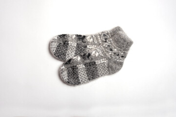 Warm fluffy wool socks on a white background.