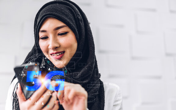 Portrait of muslim woman use digital smartphone with business technology link internet connection network earth global world wireless 5G network high-speed internet.metaverse and technology