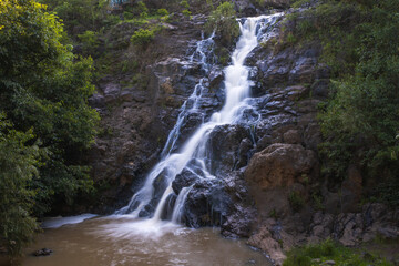 Waterfall with clear water in Los Filtros Viejos Park at Morelia, Michoacan, Mexico. Long exposure photography