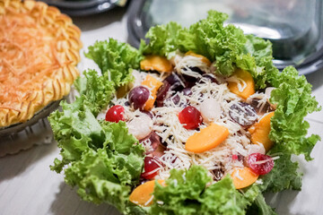 Fresh fruit salad on a bowl. Luscious healthy eating with mango oranges and passion fruit