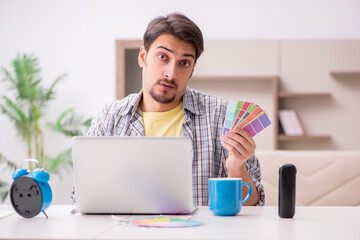 Young male freelancer in time management concept at home