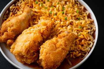 Korean instant noodles with fried chicken or Fried chicken ramyeon
