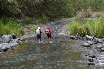 Crossing a river. Rivière de Galets, île de la Réunion, Océan Indien