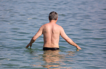A man bathes in the water