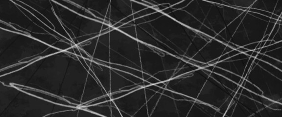 Scratched film texture. many bright lines in different directions. Panoramic background for grunge and vintage design, beautiful black abstract background. Dark neutral backdrop presentation design.