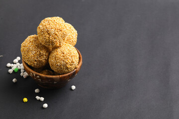 Indian sweet for traditional festival makar sankranti :Rajgira laddu made from Amaranth seed in Bowl on white background.