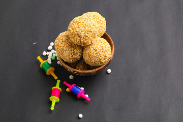 Indian sweet for traditional festival makar sankranti :Rajgira laddu made from Amaranth seed in Bowl on white background.