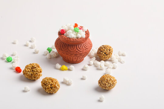 Indian festival makar sankranti concept : Tilgul in small bowl. Tilgul is a colourful sesame candy coated with sesame seeds; in Maharashtra people exchange tilgul on Sankranti