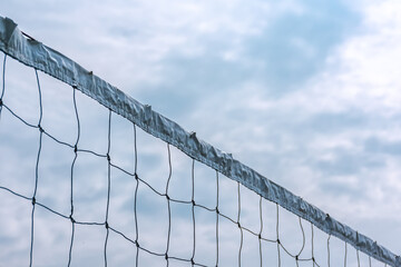 Sport white volleyball nets or mesh stretched under the clear and bright blue summer sky