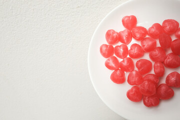Red heart shaped candy and white plate,  Romantic love in white plate, Valentines day meal concept