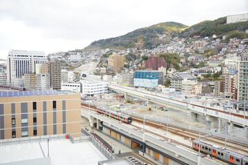 Inasayama Mountain and Nagasaki Station in Nagasaki, Japan - 日本 長崎駅前 街並み 稲佐山