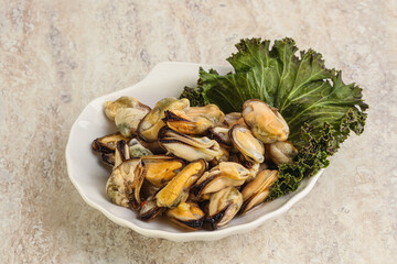 Tasty marinated mussels in the bowl