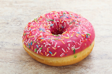 Sweet glazed struwberry donut with icing