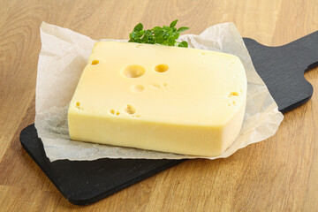 Maasdam cheese over the board