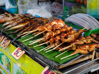 Roast chicken or Kai yang or ping gai is street food from the Lao people of Laos and Isan, but it...