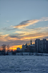 View of residential buildings in the Rybatskoye district of St. Petersburg from the right bank of the Neva River