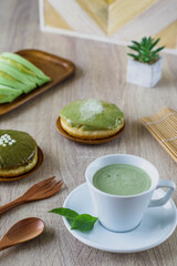 A variety of Japanese desserts with identical matcha flavors from Japan served on wooden table