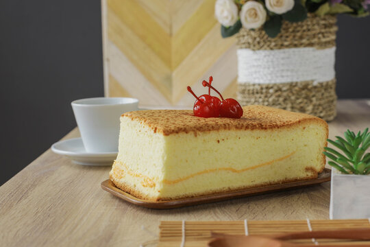 Castella the popular japanese deserts or sponge chake served on wooden table