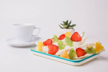 Japanese dessert fruit sandwich with a glass of matcha tea isolated on white background