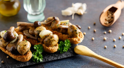 Fresh harvested assortment of edible mushrooms, oyster fungus, shimeji and white mushrooms.