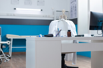 Empty medical doctor office with nobody in it ready for illness consultation equipped with...
