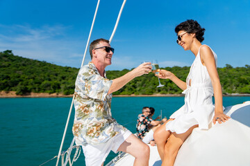 Caucasian couple enjoy outdoor luxury party drinking champagne with talking together while...
