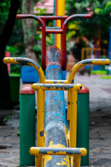empty colorful metal see saw on the public city park