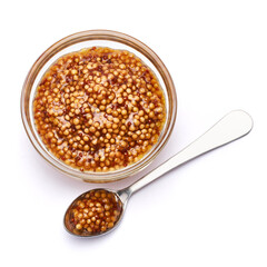 Classic Dijon mustard sauce in glass bowl isolated on white background
