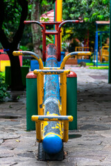 empty colorful metal see saw on the public city park