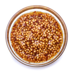 Classic Dijon mustard sauce in glass bowl isolated on white background