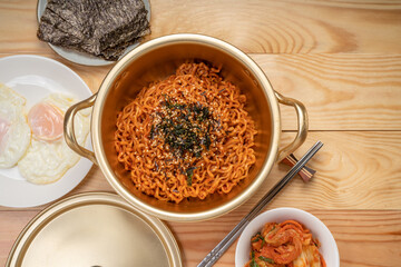 Super Spicy Korean noodles, Ramyun or hot ramen Korean dry noodles food, Korean style instant ramen spicy served with fried egg.