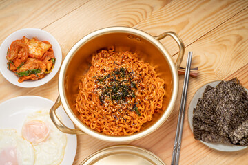 Super Spicy Korean noodles, Ramyun or hot ramen Korean dry noodles food, Korean style instant ramen spicy served with fried egg.