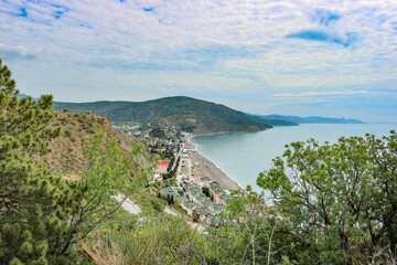 Fototapeta premium View from the mountain to the village of Rybachye and a beautiful bay with azure water, Crimea.