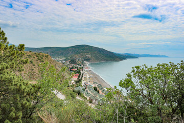 View from the mountain to the village of Rybachye and a beautiful bay with azure water, Crimea.