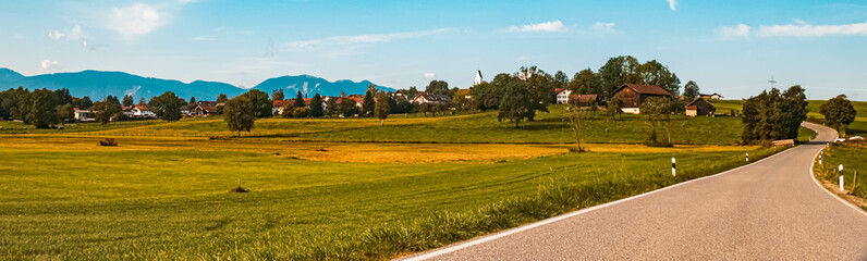 Obraz premium Beautiful alpine summer view with the alps in the background at Aidling near the famous Riegsee lake, Bavaria, Germany