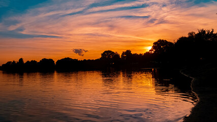 Beautiful sunset with reflections near Mamming, Isar, Bavaria, Germany