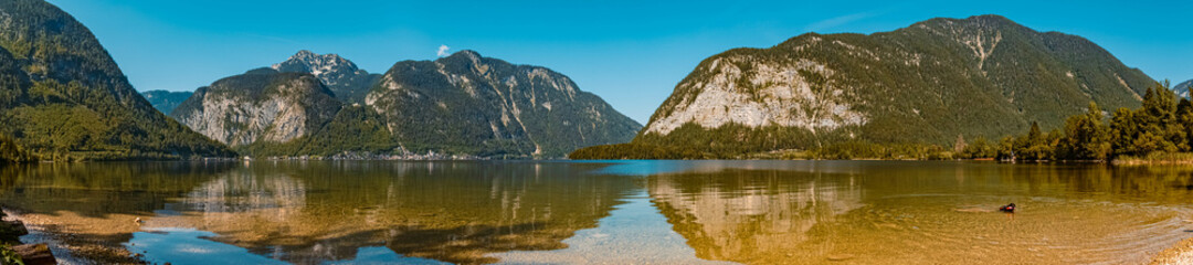 Naklejka na ściany i meble High resolution stitched panorama with reflections at the famous Hallstaetter See lake, Hallstatt, Upper Austria, Austria