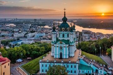 Fototapeta premium Aerial view of St. Andrew's Church during dawn, one of the most famous sights of the city of Kiev. Cityscape concept, tourism, vacation, travel
