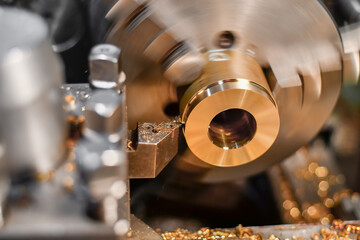 The bronze bushing is installed in the chuck jaws of the lathe and is processed with a mechanical cutter, removing the chips and bringing the part to the technological size.