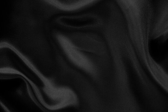 Black grey fabric texture background, detail of silk or linen pattern.