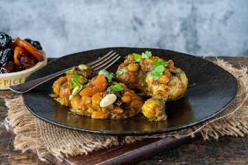 Chicken leg tagine with caramelised prunes and apricots and roasted almonds