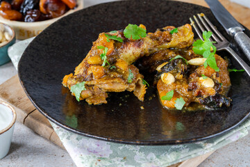 Chicken leg tagine with caramelised prunes and apricots and roasted almonds