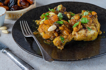 Chicken leg tagine with caramelised prunes and apricots and roasted almonds