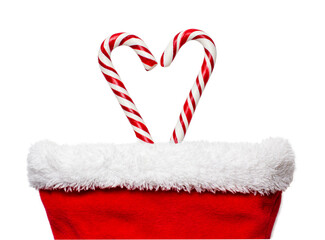 Heart candy canes in red christmas stocking isolated on white background